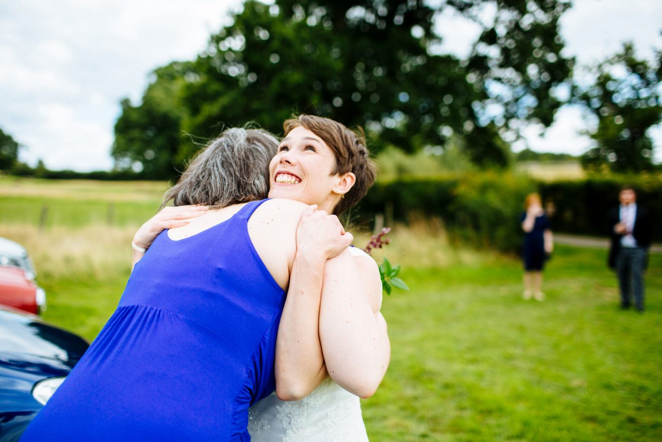 bride and bridesmaid hug