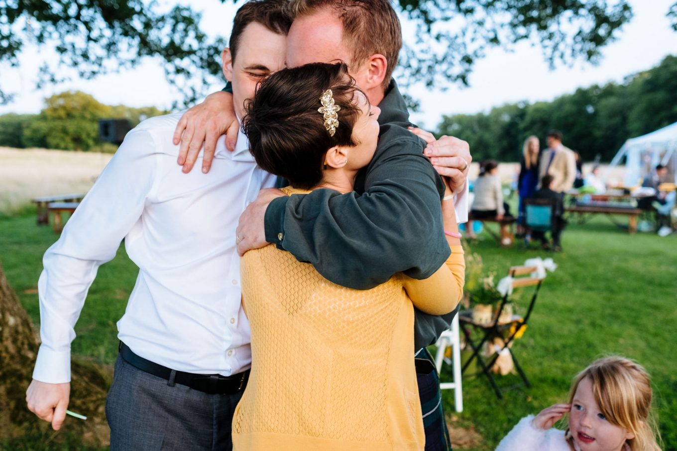 bride and groom tight hug