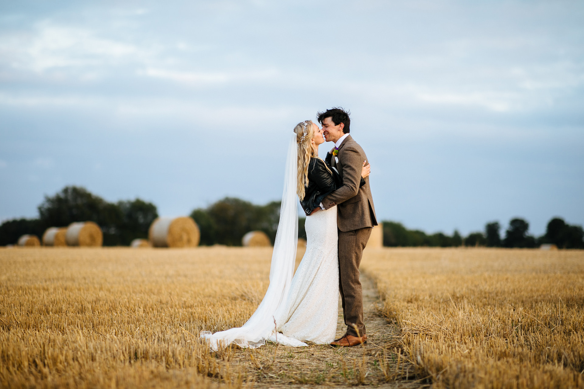 bride and groom in corn field at festival wedding in Kent