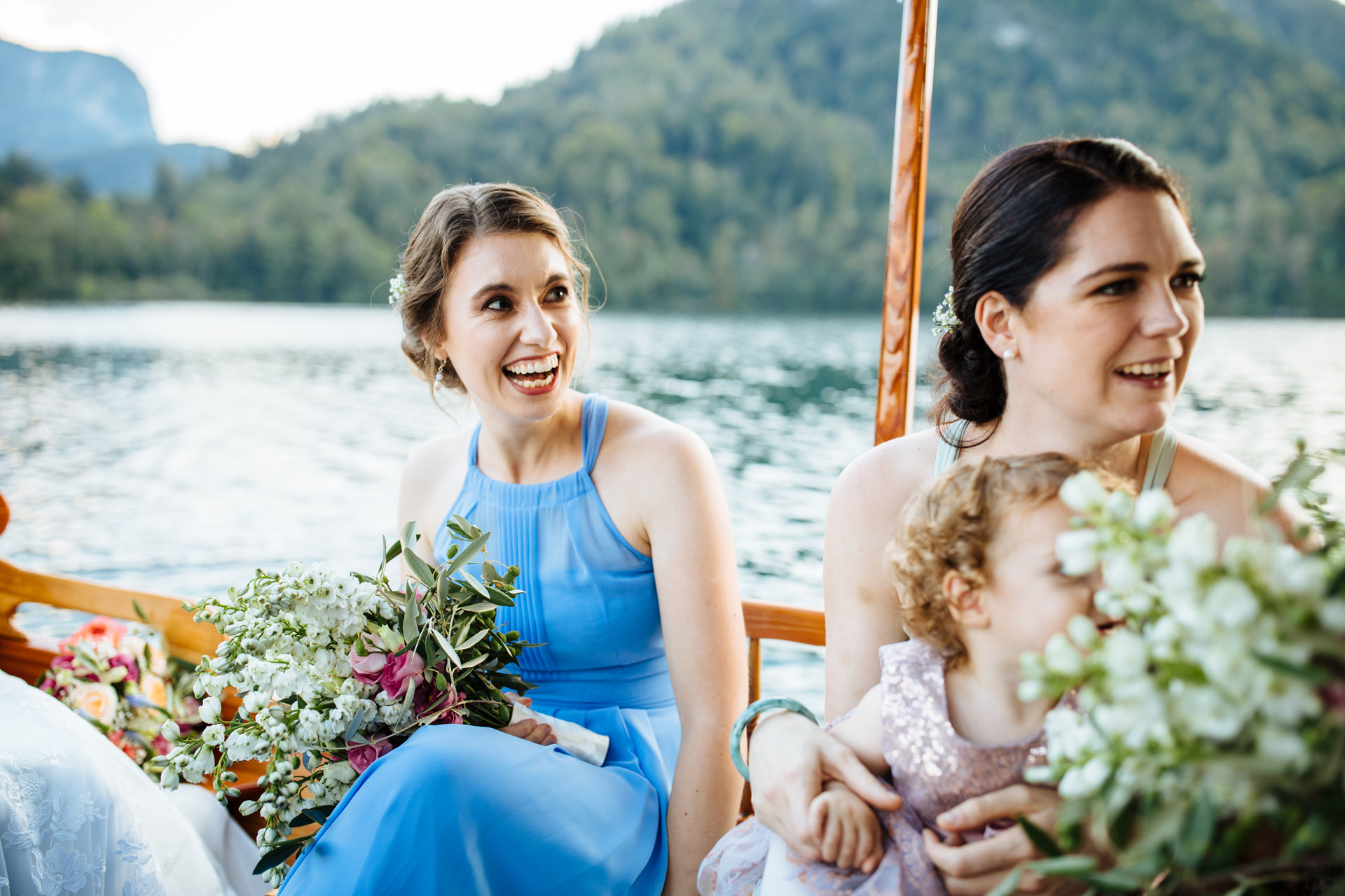 bridesmaid in blue dress on boat from bled island
