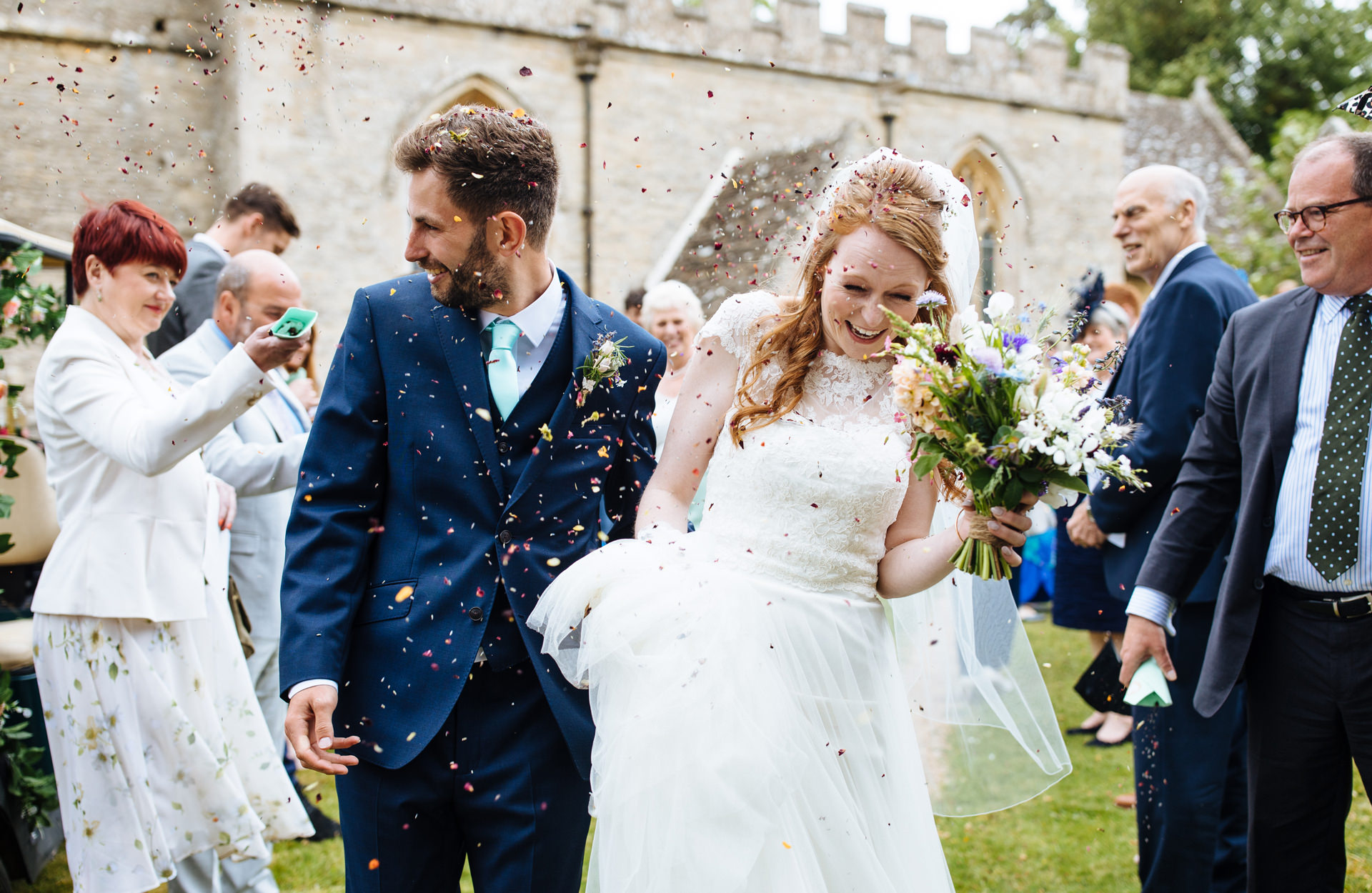 bride and groom confetti walk at oxfordshire marquee wedding