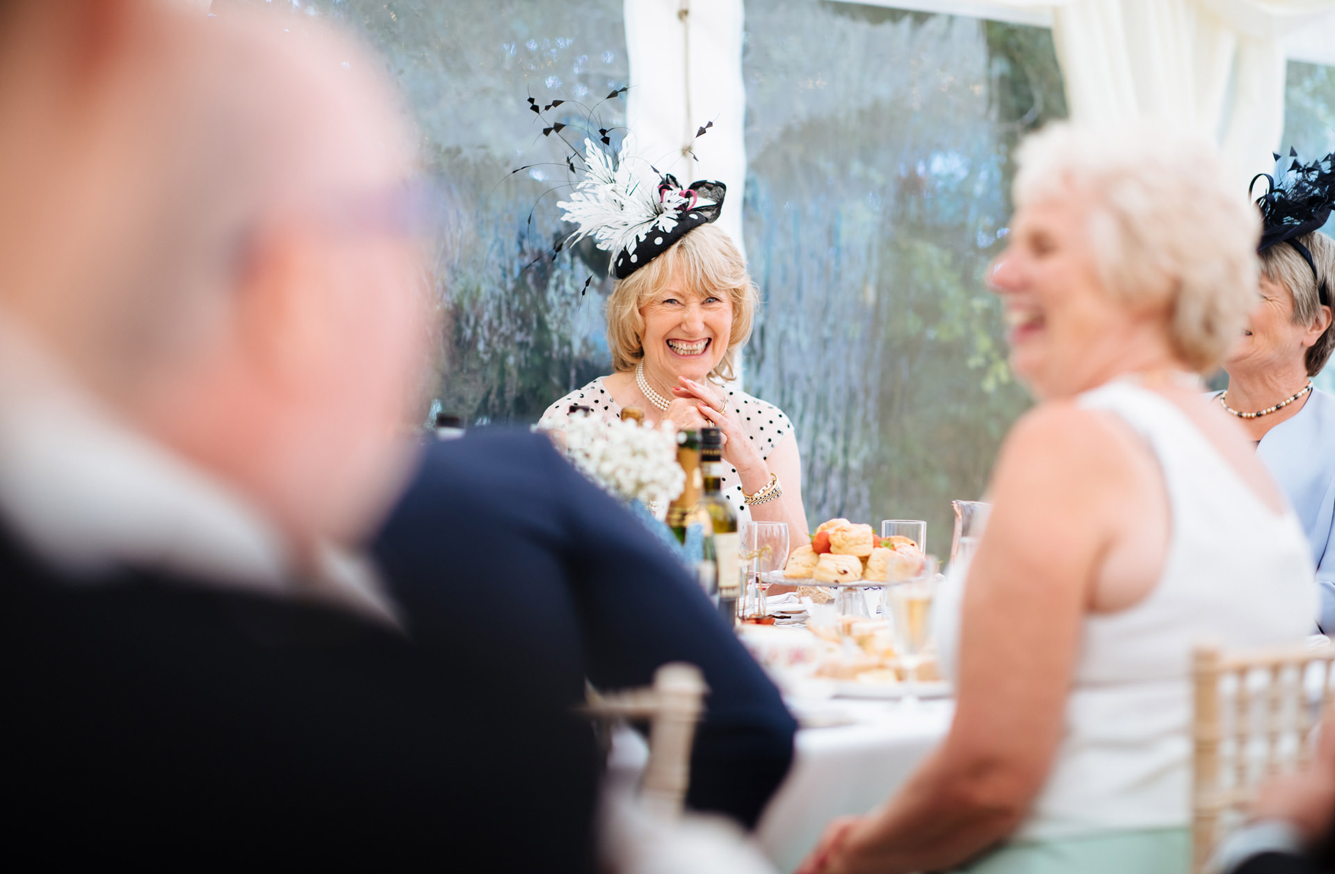 mother of the bride laughing at speeches
