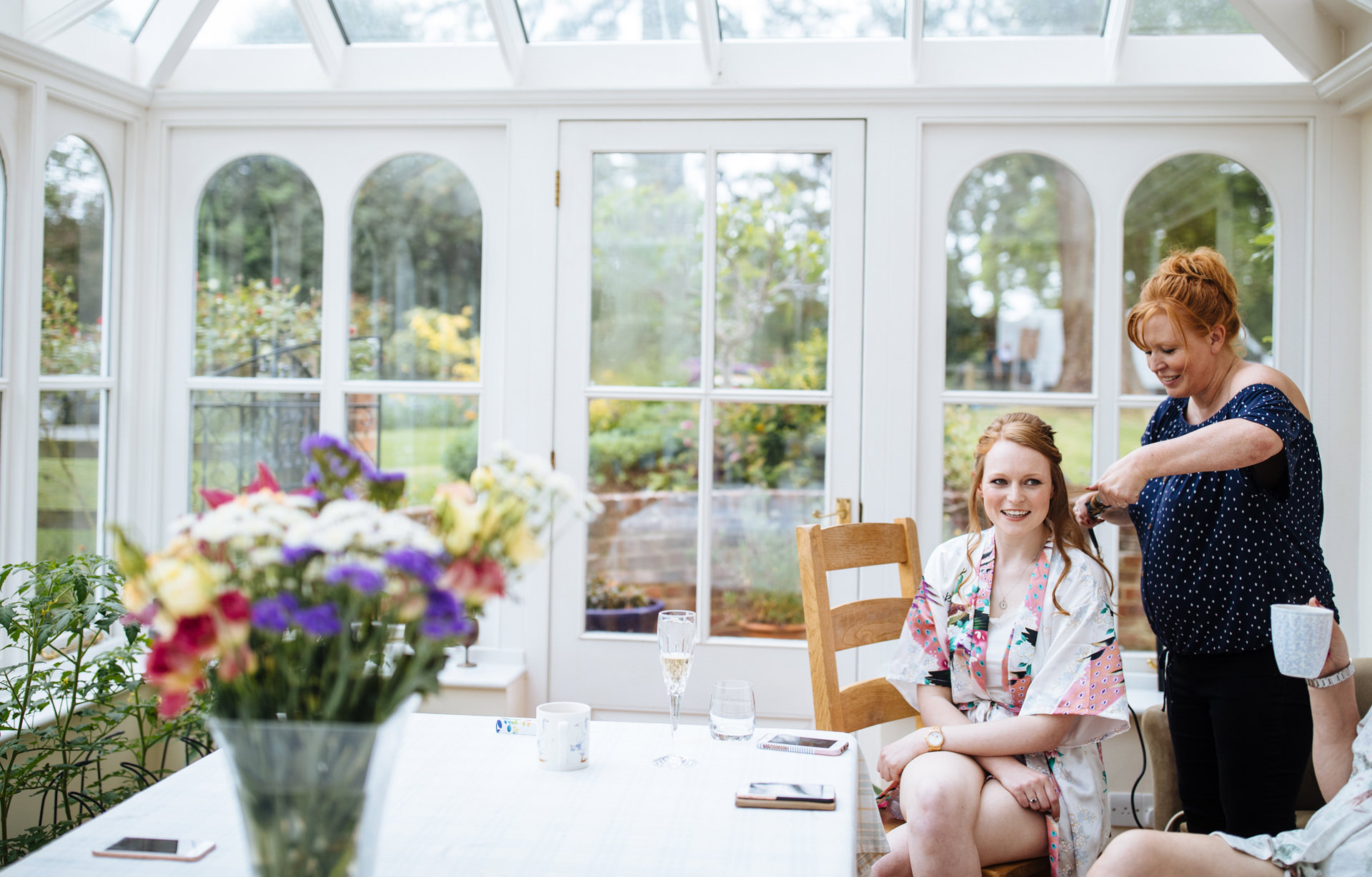 bride having hair done at oxfordshire marquee wedding